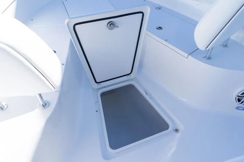 Slide: The Image of 2026 Sportsman Open 252 Center Console boat storage compartment open. - 38