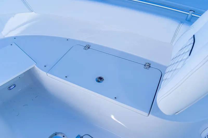 Slide: The Image of 2026 Sportsman Open 252 Center Console boat interior with storage compartment and seating. - 39