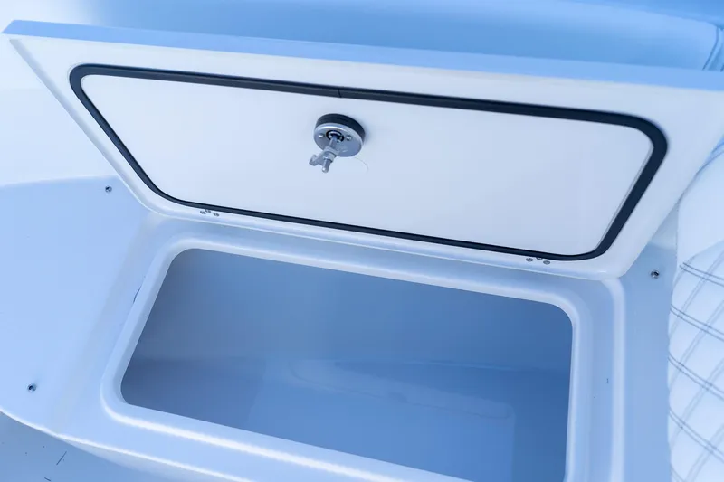Slide: The Image of Storage compartment on 2026 Sportsman Open 252 Center Console boat, featuring secure lock. - 40