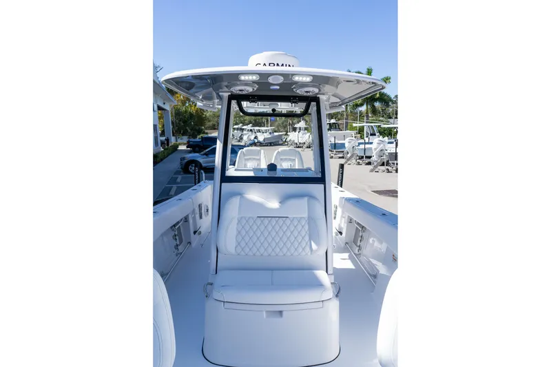 Slide: The Image of 2026 Sportsman Open 252 Center Console boat interior with seating and console view. - 43