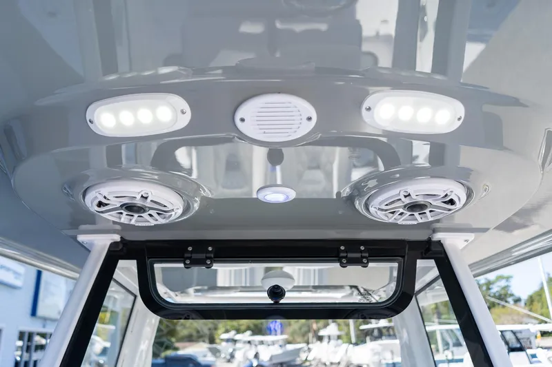 Slide: The Image of 2026 Sportsman Open 252 Center Console boat interior with speakers and LED lights. - 47