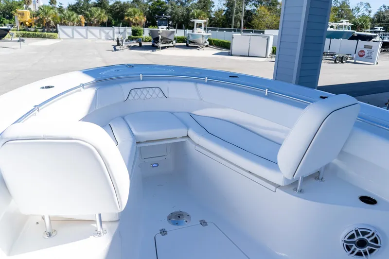 Slide: The Image of 2026 Sportsman Open 252 Center Console boat interior with white seating and modern design. - 48