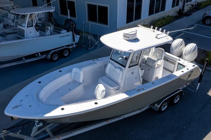 Slide: The Image of 2026 Sportsman Open 252 Center Console boat on trailer, parked outdoors. - 5