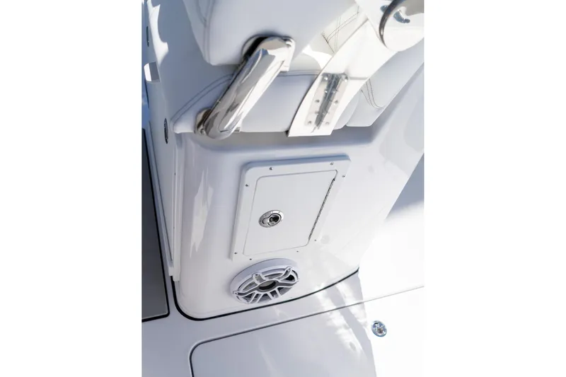 Slide: The Image of 2026 Sportsman Open 252 Center Console boat interior detail with speaker and storage compartment. - 53