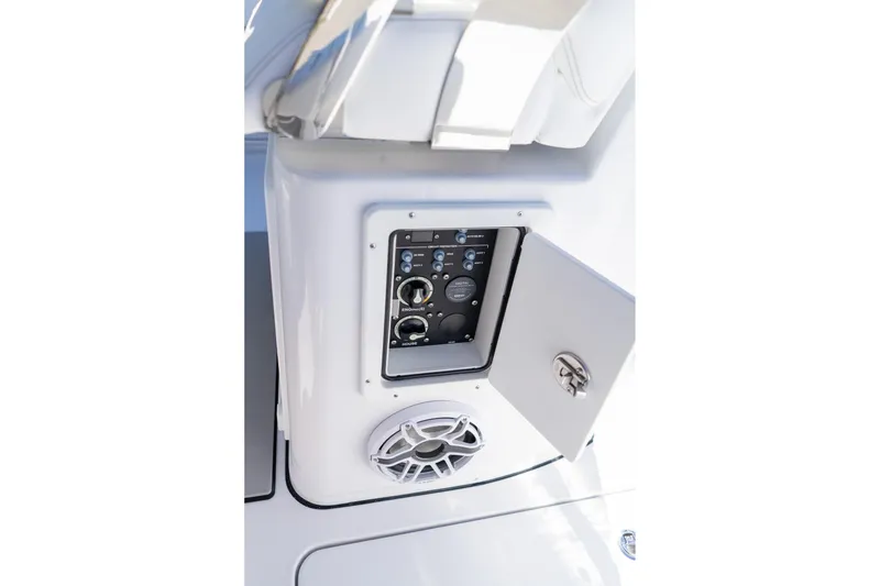 Slide: The Image of 2026 Sportsman Open 252 Center Console audio control panel with speaker. - 54