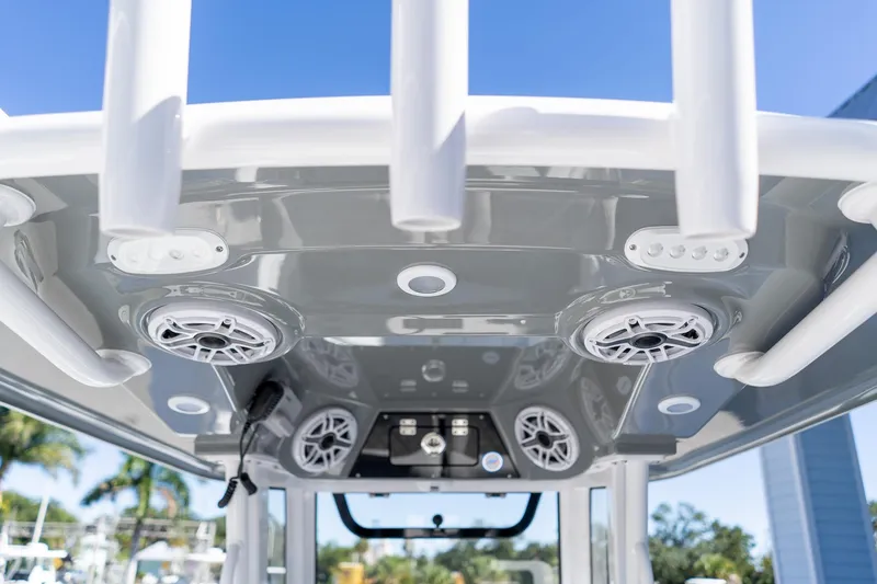 Slide: The Image of 2026 Sportsman Open 252 Center Console boat with speakers and rod holders. - 57