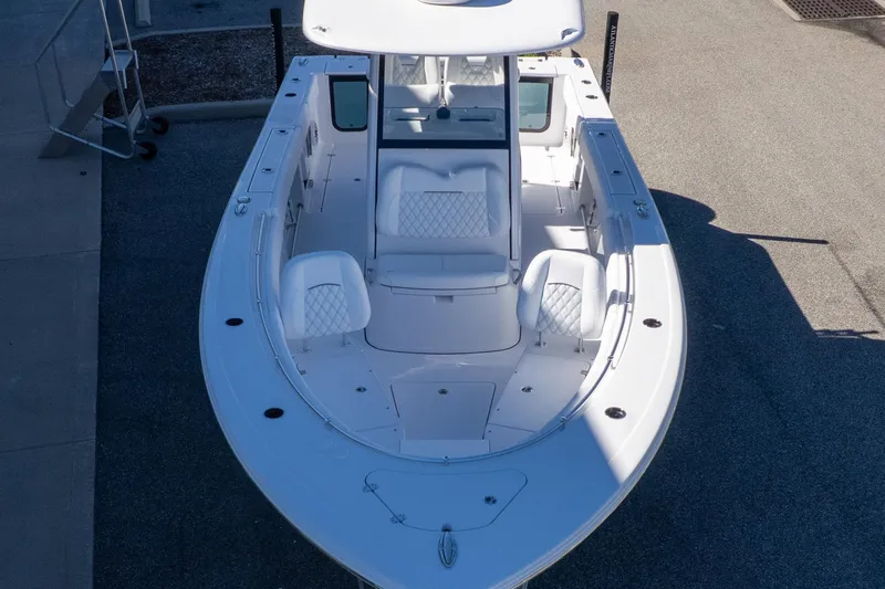 Slide: The Image of 2026 Sportsman Open 252 Center Console boat, aerial view, showcasing seating and deck layout. - 7