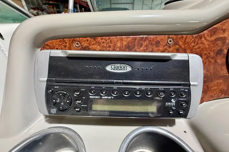 Slide: The Image of Clarion stereo system on 2004 Formula 260 Bowrider boat dashboard. - 15