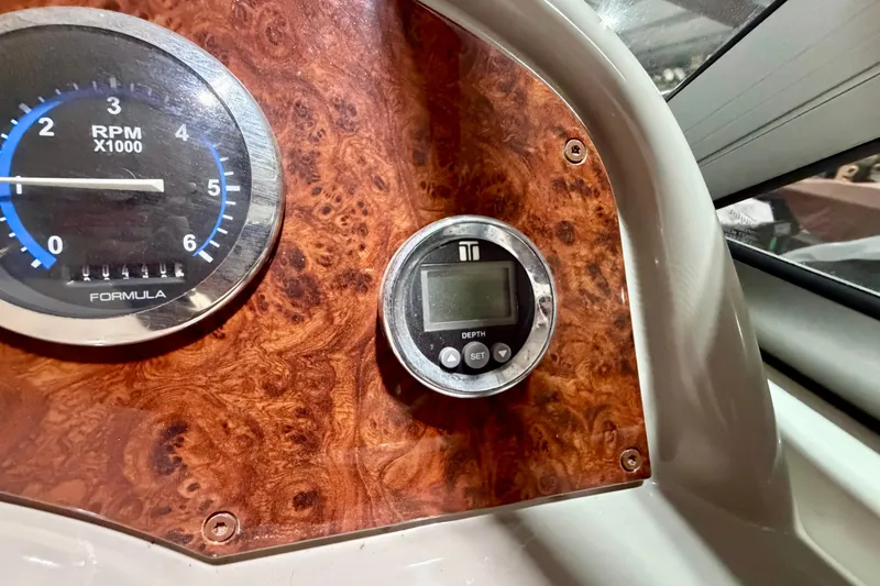Slide: The Image of Dashboard of 2004 Formula 260 Bowrider with RPM gauge and depth meter. - 17