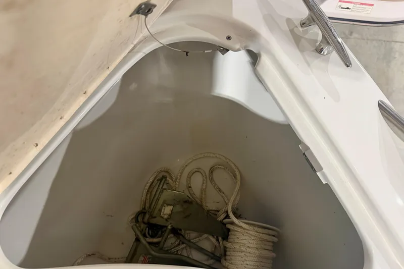 Slide: The Image of Storage compartment of a 2004 Formula 260 Bowrider with rope and anchor. - 27
