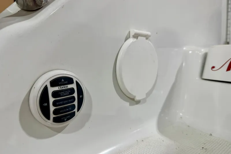 Slide: The Image of 2004 Formula 260 Bowrider audio controls and panel on white surface. - 32