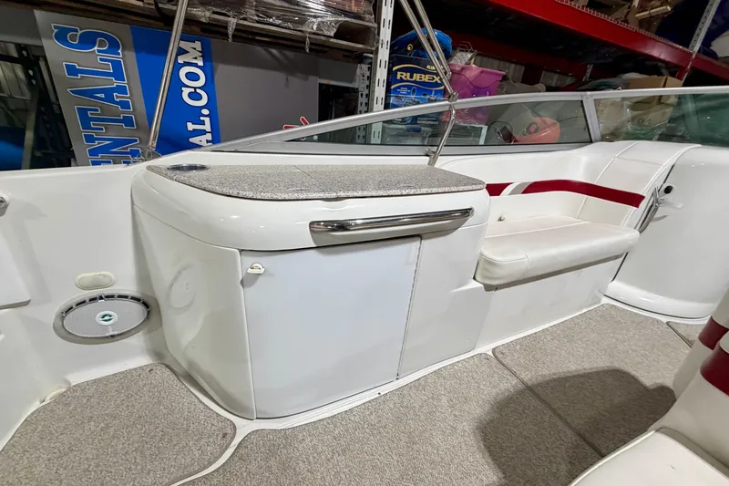 Slide: The Image of 2004 Formula 260 Bowrider interior with seating and storage, showcasing sleek design and functionality. - 9