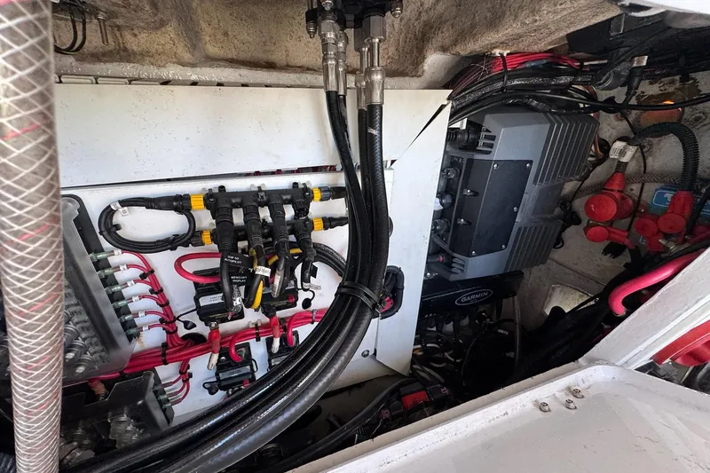 Slide: The Image of Electrical compartment of a 2007 Conch 27 boat with safety equipment and wiring. - 17