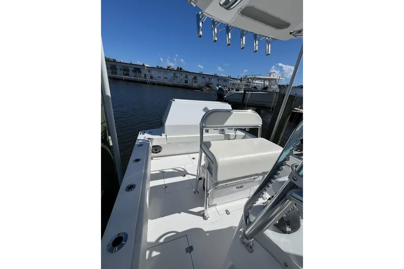 Slide: The Image of 2007 Conch 27 boat with Garmin equipment, docked at a marina under clear skies. - 21