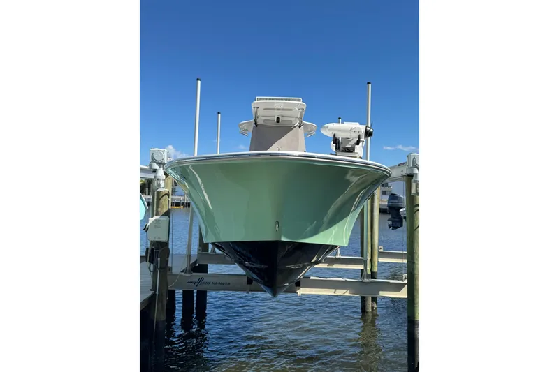 Slide: The Image of 2007 Conch 27 boat with dual outboard engines on water. - 25