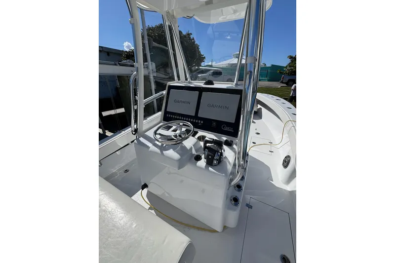 Slide: The Image of 2007 Conch 27 boat interior with modern navigation equipment and seating. - 3