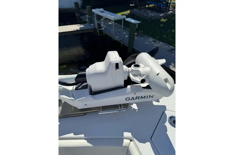 Slide: The Image of 2007 Conch 27 boat deck with mounted equipment, parked truck in background. - 9