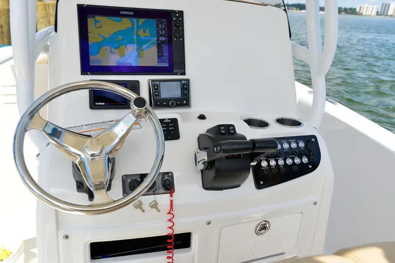 Slide: The Image of Manufacturer Provided Image: 2020 NauticStar 25 XS Offshore boat dashboard with navigation system and controls. - 10