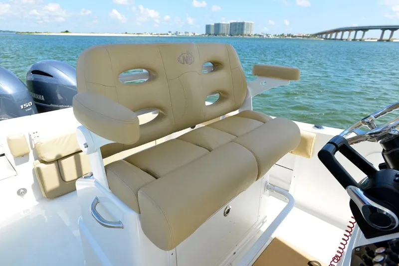 Slide: The Image of Manufacturer Provided Image: 2020 NauticStar 25 XS Offshore boat with tan seating and dual Yamaha engines. - 11