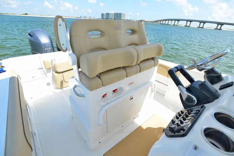 Slide: The Image of Manufacturer Provided Image: 2020 NauticStar 25 XS Offshore boat interior with helm and seating. - 12