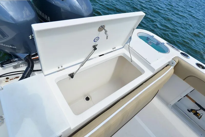 Slide: The Image of Manufacturer Provided Image: 2020 NauticStar 25 XS Offshore boat with open storage compartment. - 14