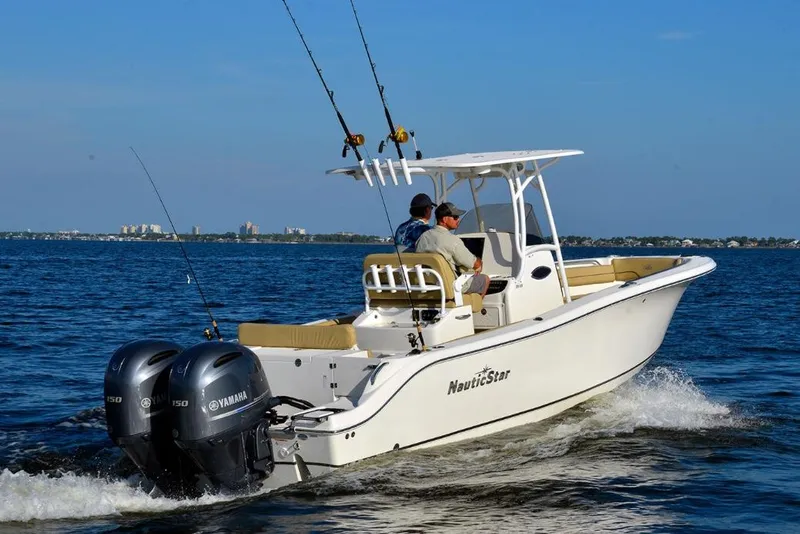 Slide: The Image of Manufacturer Provided Image: 2020 NauticStar 25 XS Offshore boat cruising on open water. - 3