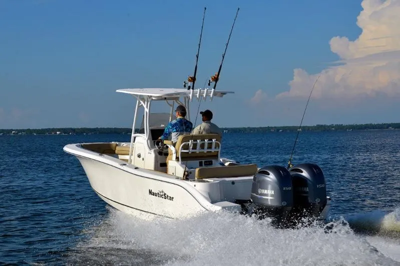 Slide: The Image of Manufacturer Provided Image: 2020 NauticStar 25 XS Offshore boat cruising on open water. - 4