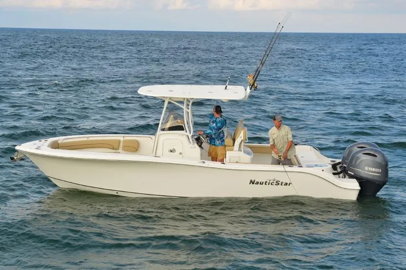 Slide: The Image of Manufacturer Provided Image: 2020 NauticStar 25 XS Offshore boat on the water with two people fishing. - 5