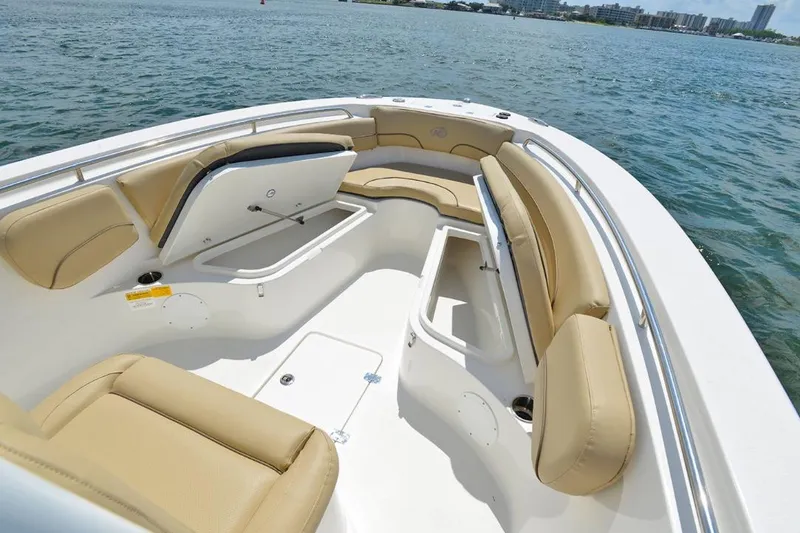 Slide: The Image of Manufacturer Provided Image: 2020 NauticStar 25 XS Offshore boat with spacious seating and storage compartments. - 7