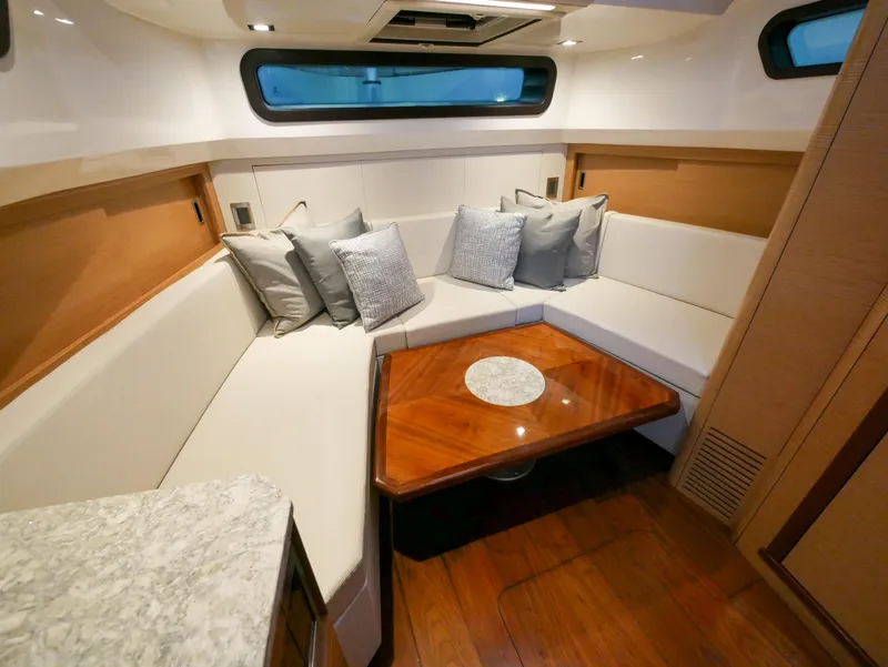 Slide: The Image of Luxurious interior of 2020 Ocean Alexander 45 Divergence Sport yacht with elegant seating and table. - 23
