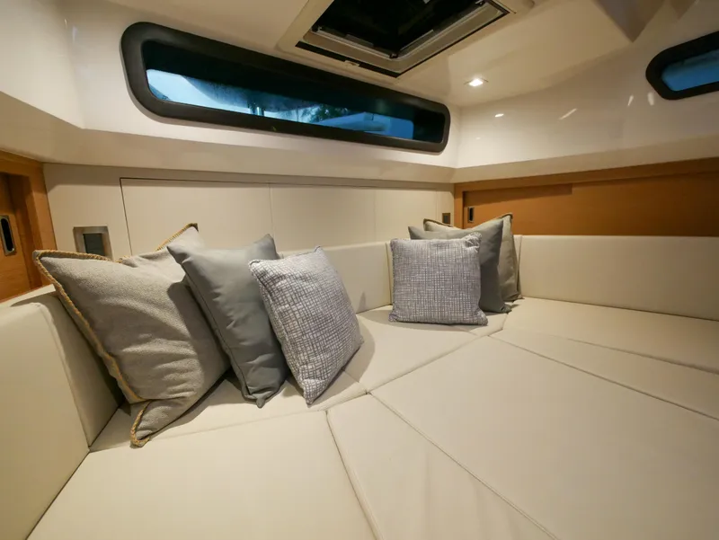 Slide: The Image of Interior of 2020 Ocean Alexander 45 Divergence Sport, featuring plush seating and cushions. - 24