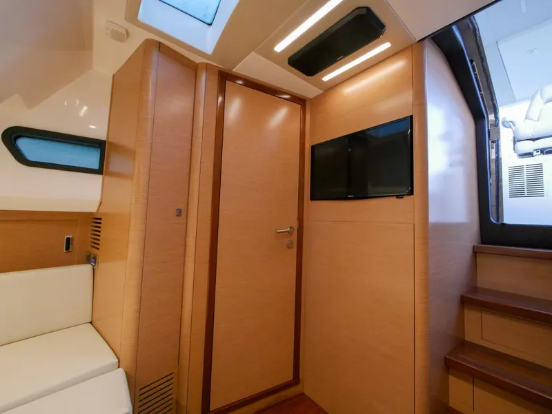 Slide: The Image of Interior of 2020 Ocean Alexander 45 Divergence Sport, featuring modern wood paneling and seating. - 27