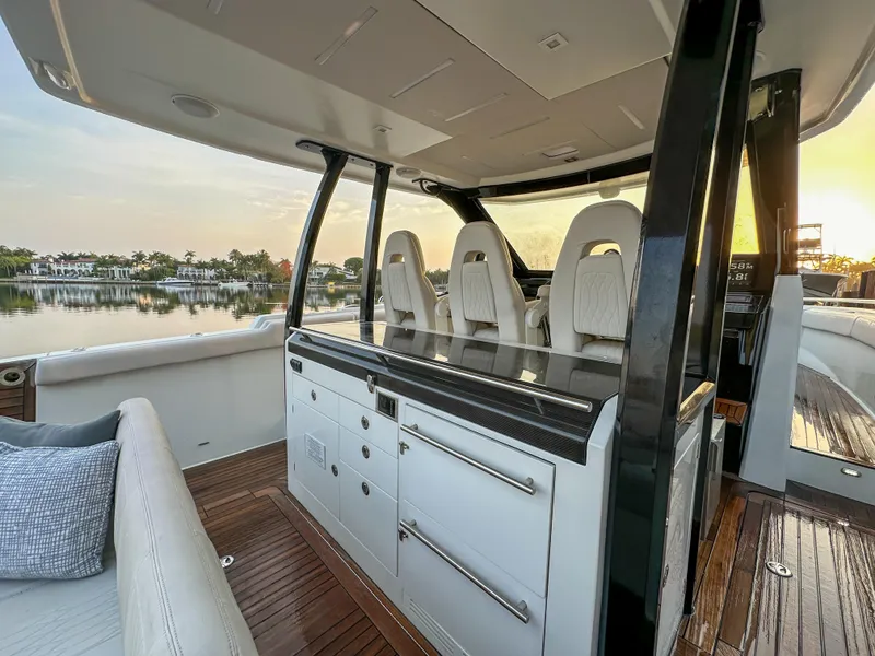 Slide: The Image of 2020 Ocean Alexander 45 Divergence Sport yacht interior with luxurious seating and cabinetry. - 9