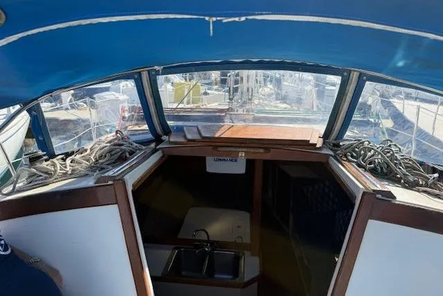 Slide: The Image of Interior view of a 1986 Catalina 36 sailboat cockpit with ropes and sink. - 16