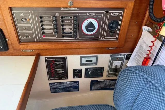 Slide: The Image of Electrical control panel of a 1986 Catalina 36 sailboat with various switches and gauges. - 6