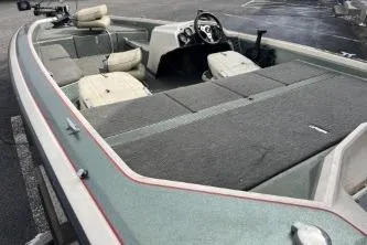 Slide: The Image of 1993 Bullet 20XD boat interior with seating and steering console. - 3