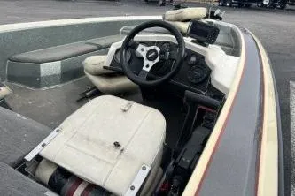 Slide: The Image of 1993 Bullet 20XD boat interior with steering wheel and seating. - 5