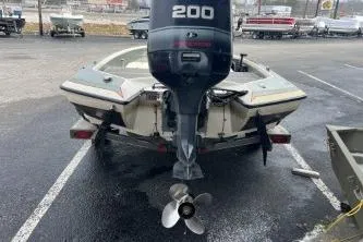 Slide: The Image of 1993 Bullet 20XD boat with 200 HP outboard motor in parking lot. - 6