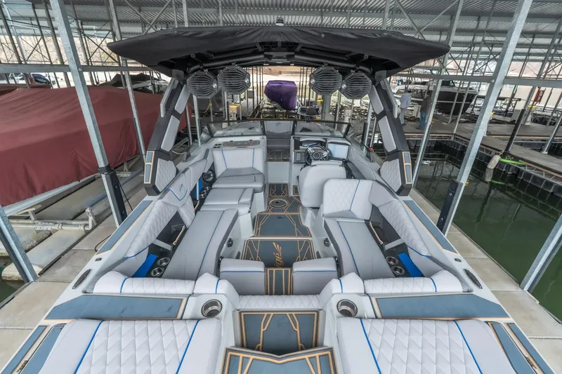 Slide: The Image of 2026 Tigé Z3 boat interior with luxurious seating and modern design in a covered dock. - 10