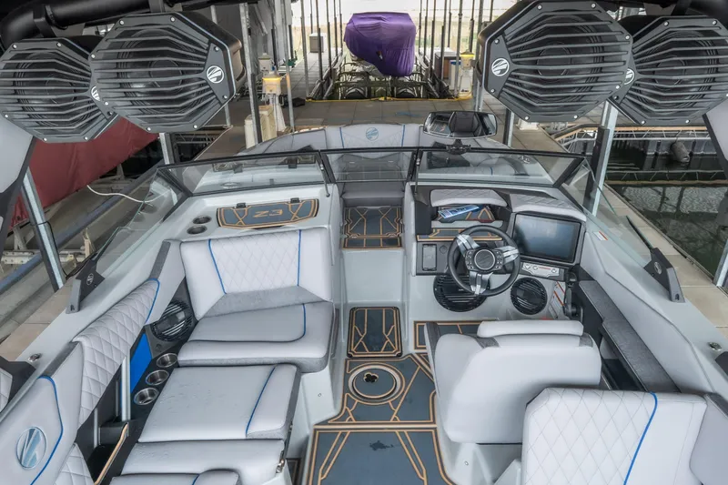 Slide: The Image of 2026 Tigé Z3 boat interior with modern dashboard, luxury seating, and advanced audio system. - 11