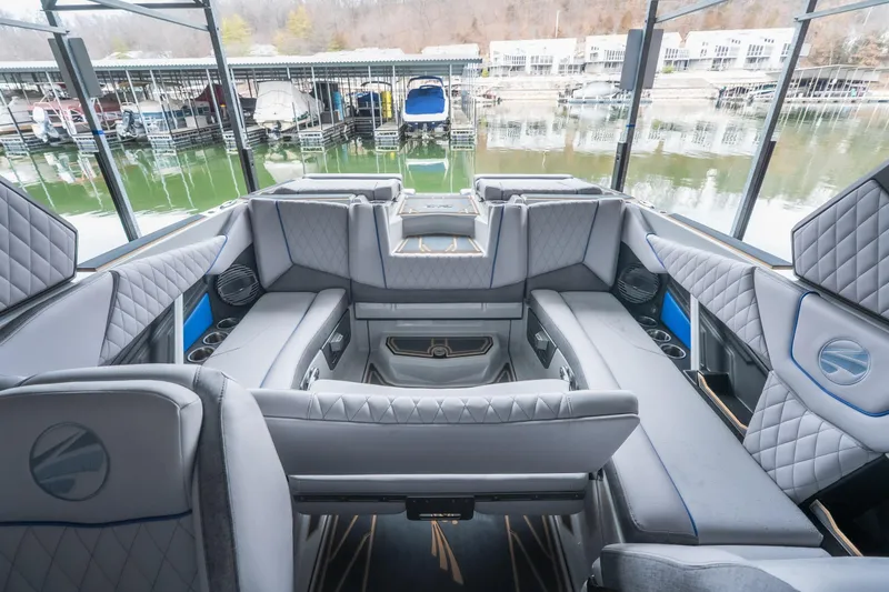 Slide: The Image of 2026 Tigé Z3 boat interior with luxurious seating and modern design at a marina. - 19