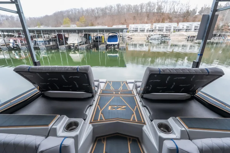 Slide: The Image of 2026 Tigé Z3 boat interior with luxurious seating at a marina. - 21
