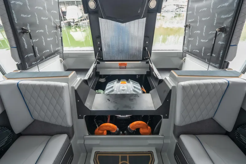 Slide: The Image of 2026 Tigé Z3 boat interior showcasing engine compartment and seating area. - 24