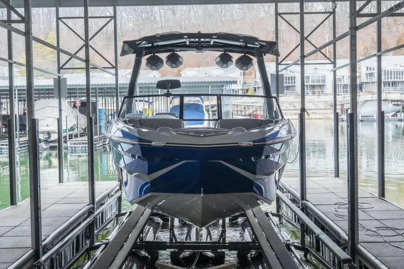 Slide: The Image of 2026 Tigé Z3 boat docked in a marina, showcasing sleek design and modern features. - 34