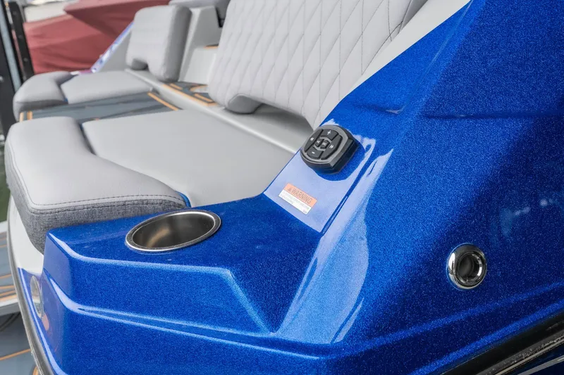 Slide: The Image of 2026 Tigé Z3 boat interior with blue metallic finish and comfortable seating. - 7