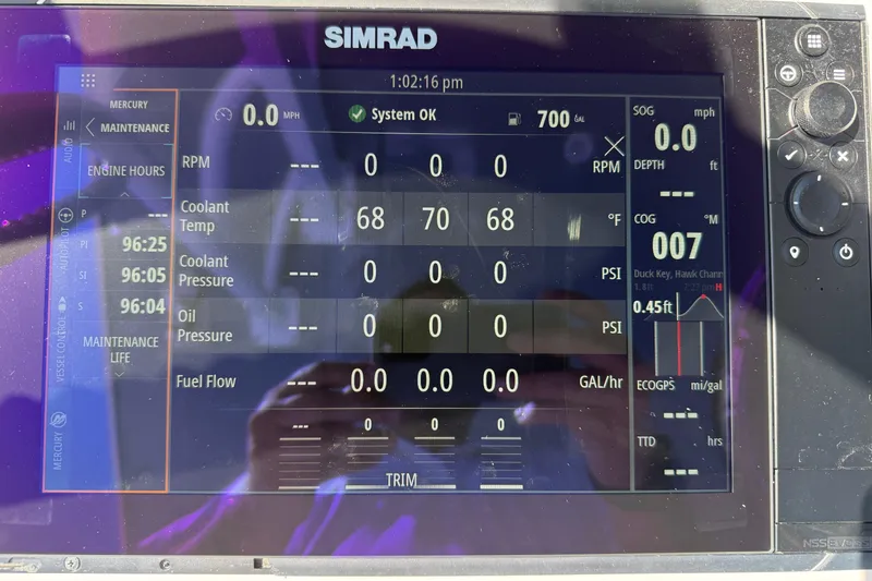 Slide: The Image of Simrad display on 2023 Invincible 46 Catamaran showing engine and navigation data. - 20