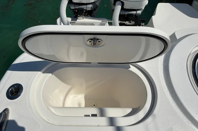 Slide: The Image of Open storage compartment on 2023 Invincible 46 Catamaran, showcasing sleek design and functionality. - 26