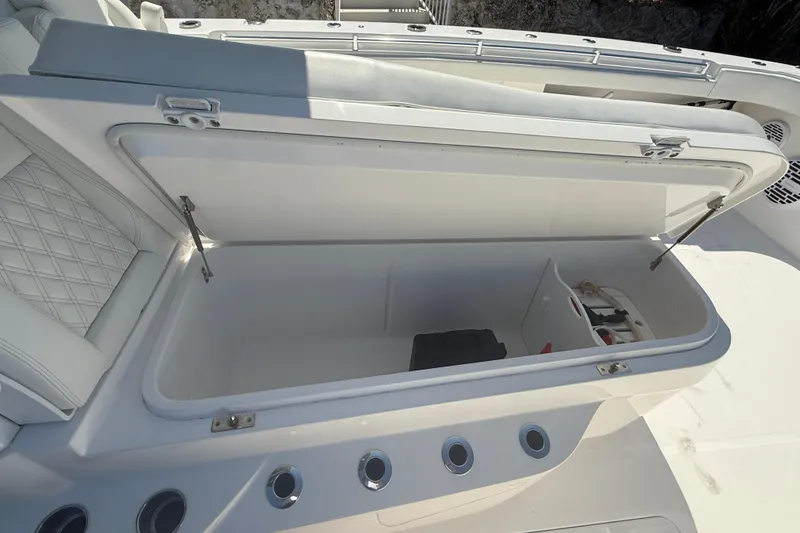 Slide: The Image of Open storage compartment on 2023 Invincible 46 Catamaran, featuring sleek design and ample space. - 28