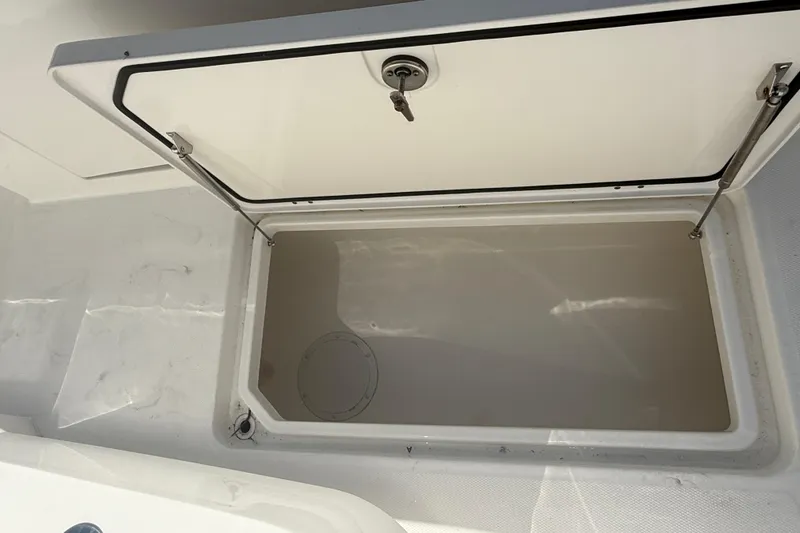 Slide: The Image of Open storage compartment on 2023 Invincible 46 Catamaran, showcasing interior space. - 30