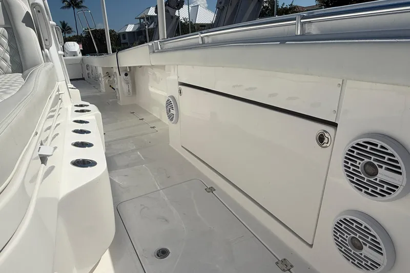 Slide: The Image of 2023 Invincible 46 Catamaran interior with seating, rod holders, and speakers. - 31
